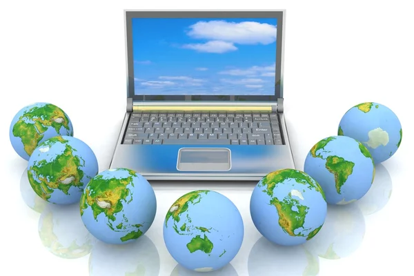 Laptop and globes — Stock Photo, Image