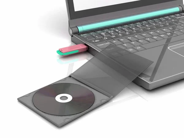 CD se trouve à côté d'un ordinateur portable dans lequel le lecteur flash inséré. isolé sur blanc — Photo