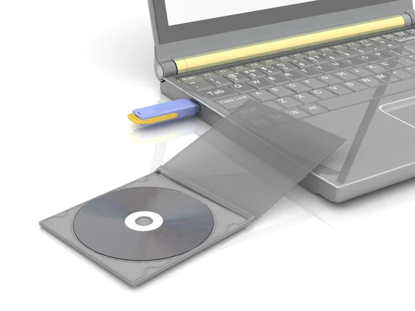 CD se encuentra junto a un portátil en el que se inserta la unidad flash. aislado en blanco —  Fotos de Stock