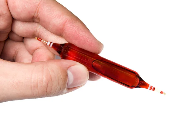 Hand holding a vial — Stock Photo, Image