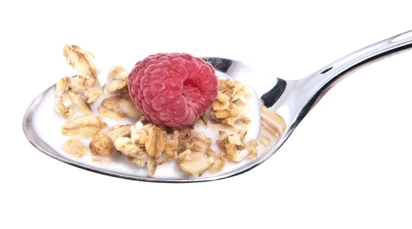 Fruits with muesli on a spoon — Stock Photo, Image