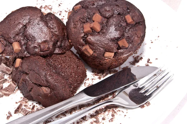 Brown muffins with chocolate on a plate — Stock Photo, Image