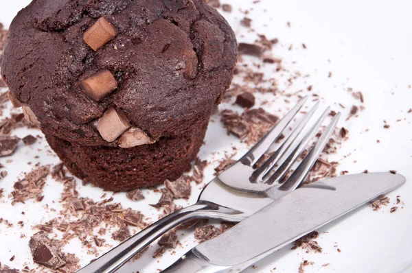 Brown muffins with chocolate and cutlery — Stock Photo, Image