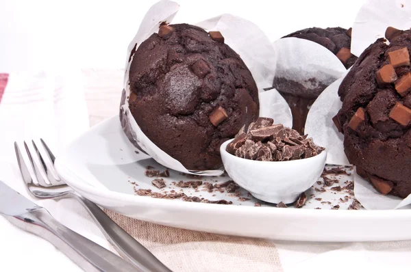 Fresh chocolate muffins on a plate — Stock Photo, Image