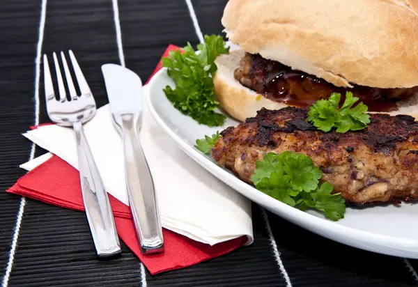 Burger on a roll — Stockfoto