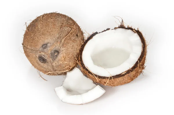 A cracked coconut on white background — Stock Photo, Image