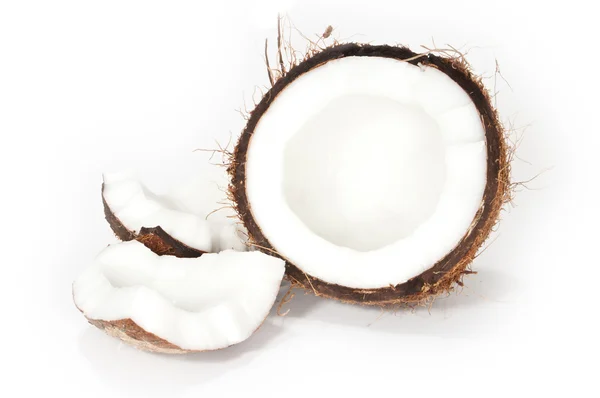 stock image A cracked coconut on white background