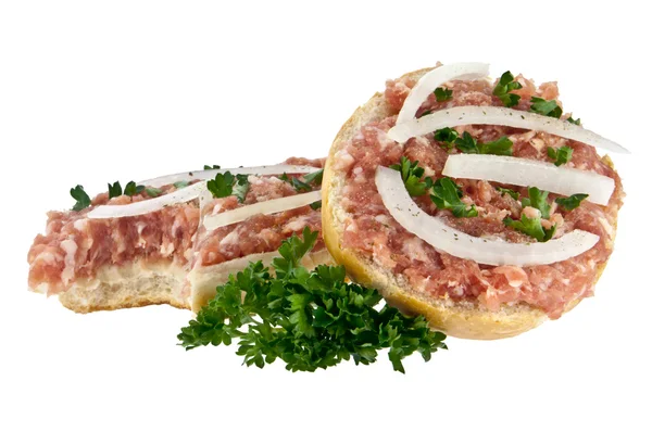 Bitten off halved roll with minced pork — Stock Photo, Image