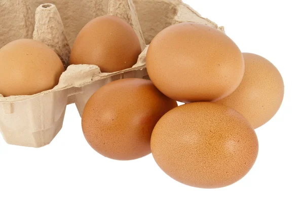 Eggs in front of a box — Stock Photo, Image