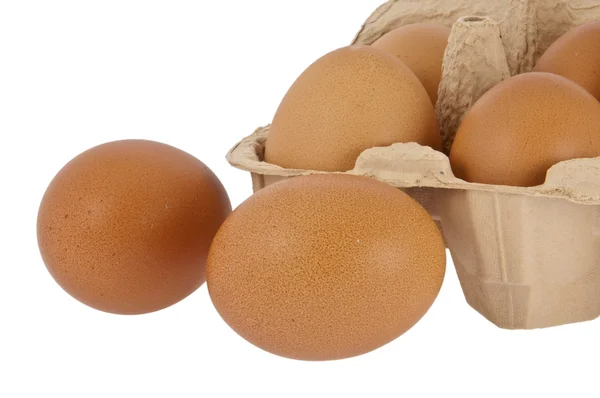 Eggs in front of a box — Stock Photo, Image