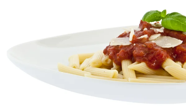 Penne with sauce, basil and chese on a plate Stock Photo