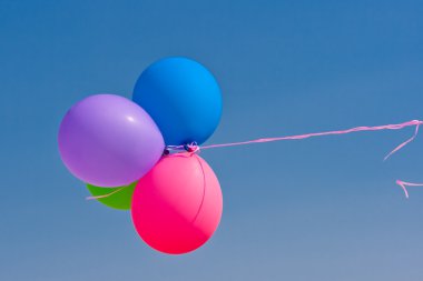 Balloons flying in the sky clipart