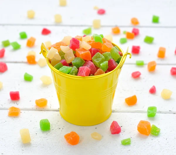 Colorful candied fruits in a small bucket — Stock Photo, Image