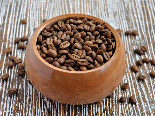Coffee beans in a wooden bowl — Stock Photo, Image