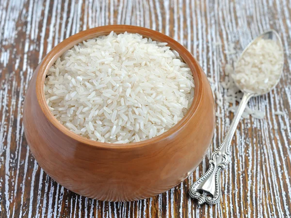 Rice in wooden bowl — Stock Photo, Image