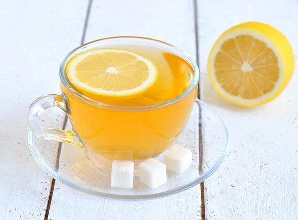 Tea with lemon in a transparent cup — Stock Photo, Image