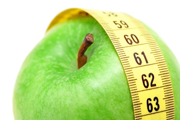 Close up view on apple and measuring tape — Stock Photo, Image