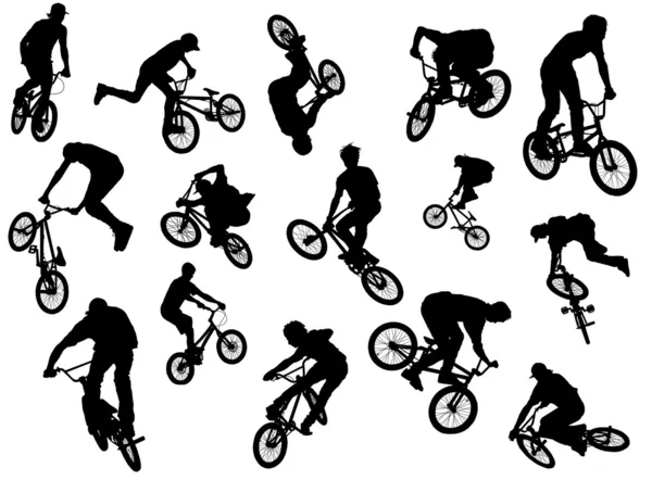 Black silhouettes of bmx and mtb riders — Stock Photo, Image
