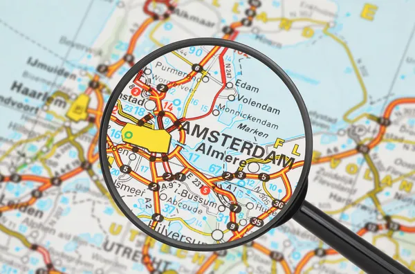 Destination - Amsterdam (magnifying glass) — Stock Photo, Image