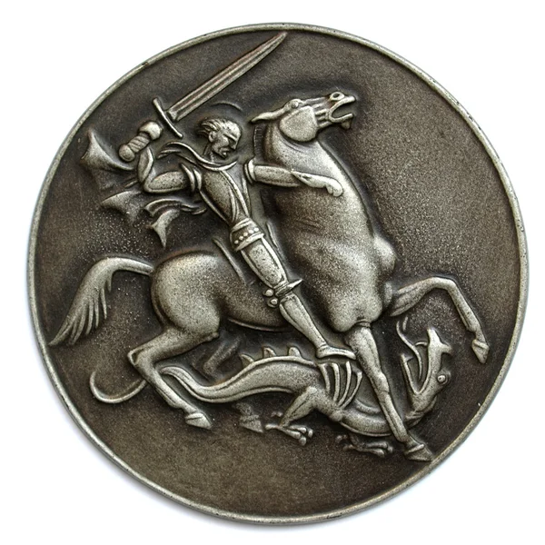 Metal medal depicting St George as a horse rider fighting a drak — Stock Photo, Image