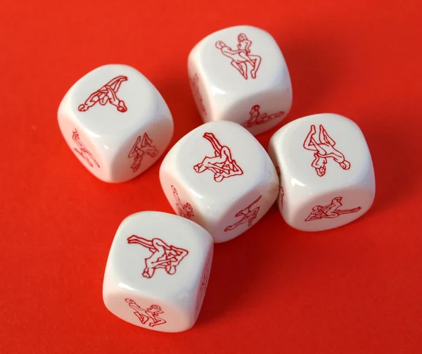 Erotic dices on red background — Stock Photo, Image