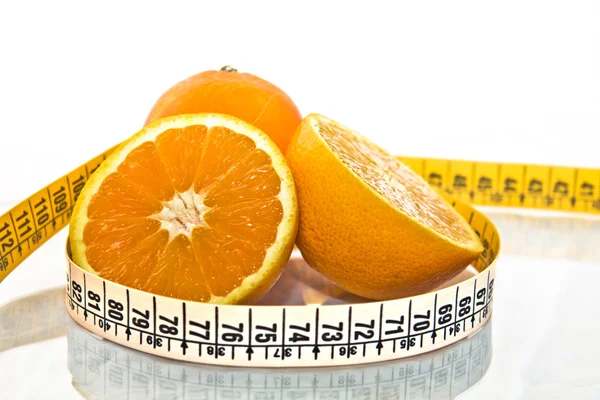 Orange measured by tape meter — Stock Photo, Image