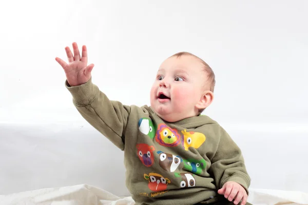 Een kind trekt de hand naar object — Stockfoto