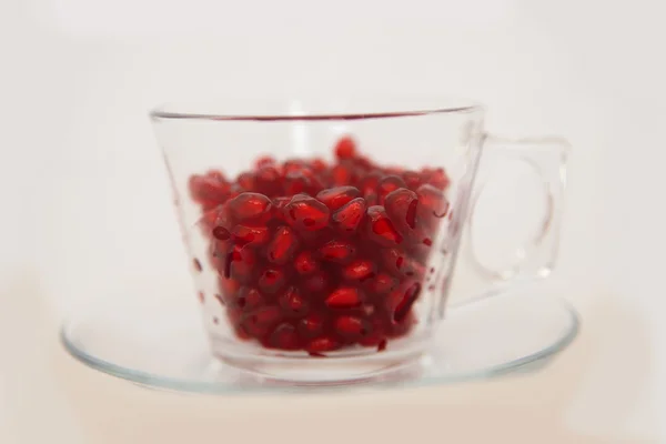 Juicy pomegranate seeds in a glass — Stock Photo, Image
