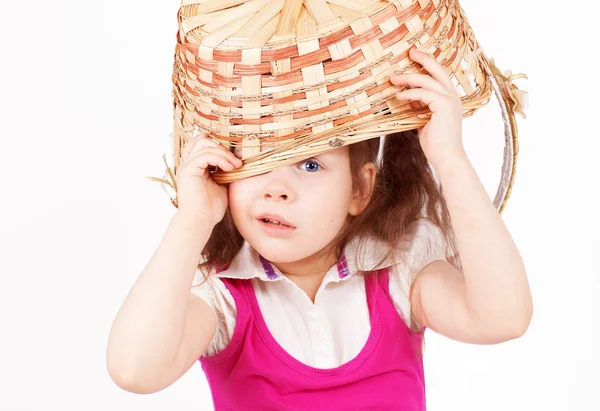 Beautiful little girl with a basket — Stock Photo, Image