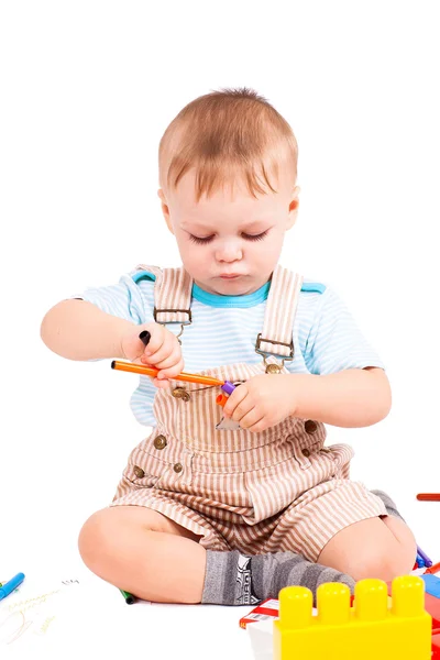 stock image Two years boy collects constructor