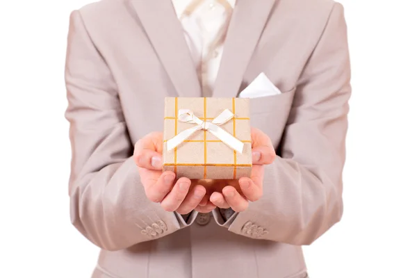 Hands stretched with a present box Stock Picture