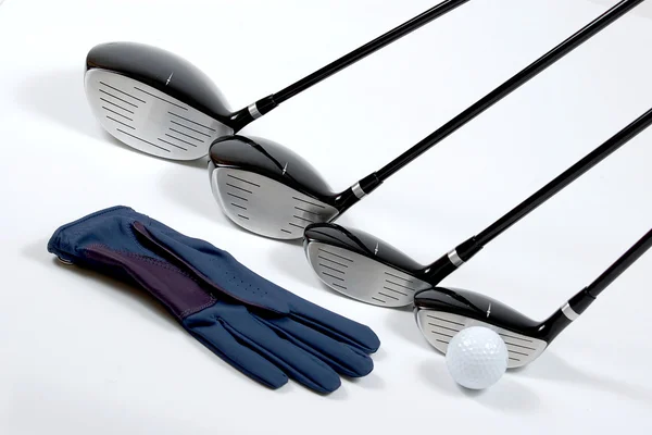 Golf clubs with ball and glove — Stock Photo, Image