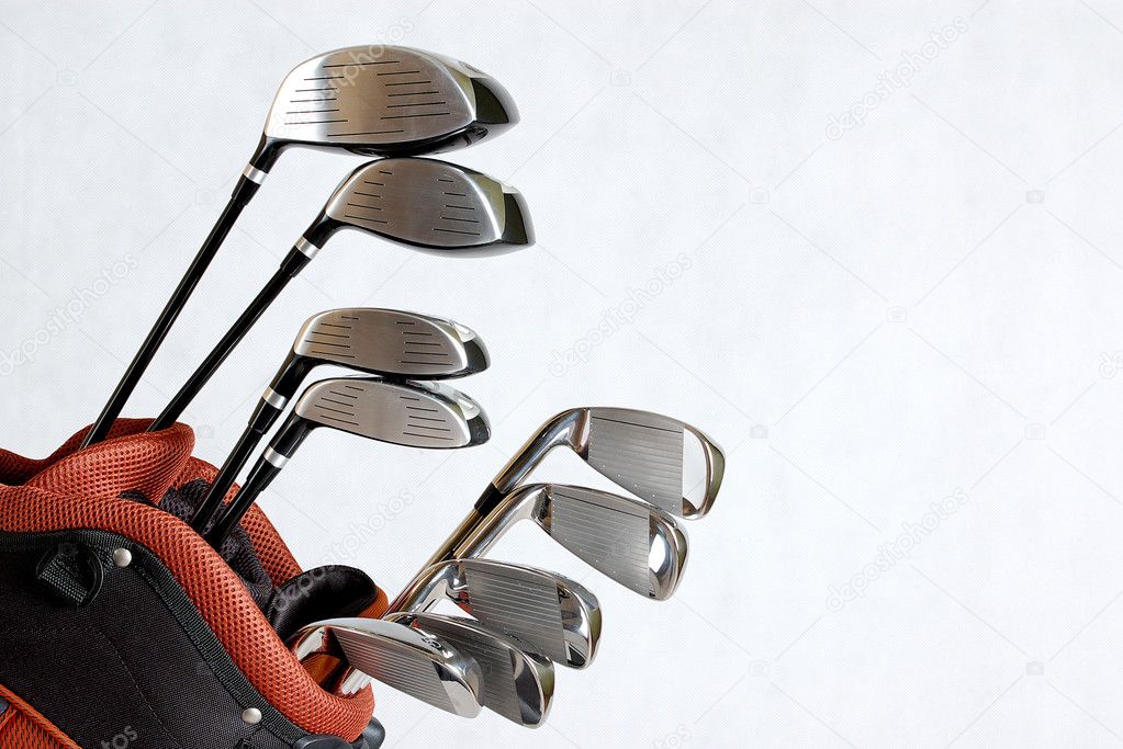 Golf clubs on white