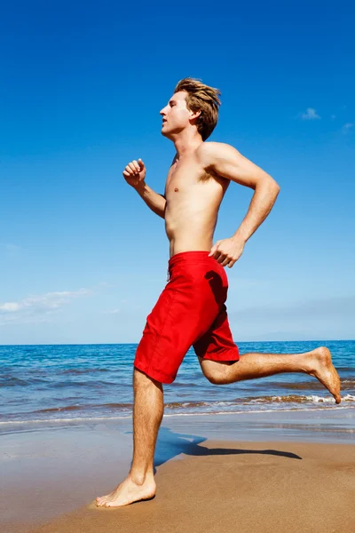 Löpare på stranden — Stockfoto