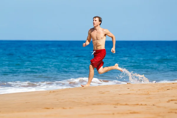 Löpare på stranden — Stockfoto