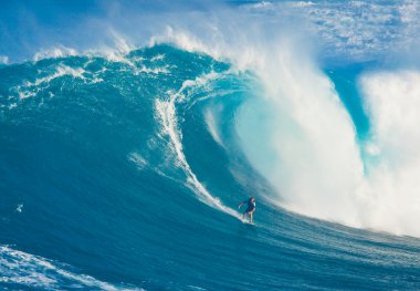 MAUI, HI - MARCH 13: Professional surfer Billy Kemper rides a gi clipart