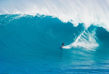 MAUI, HI - MARCH 13: Professional surfer Billy Kemper rides a gi clipart