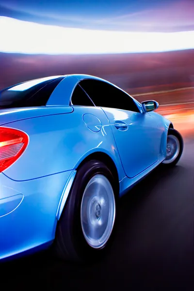 Carro desportivo rápido com movimento Blur — Fotografia de Stock