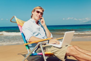 Business man at the beach clipart