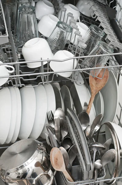 Dish washer with clean and shiny dishes and kitchenware — Stock Photo, Image