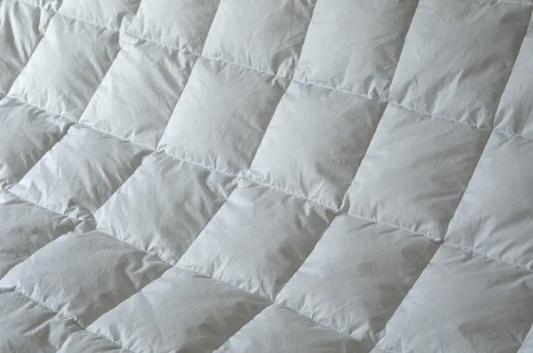 Detail of down comforter — Stock Photo, Image