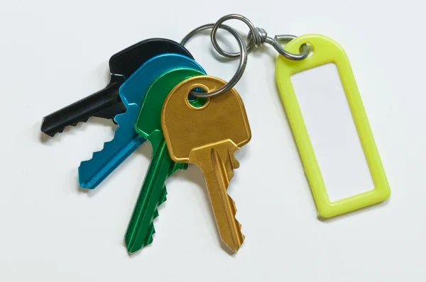 Group of keys of many colors with identification holder — Stock Photo, Image