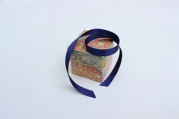 Box with blue ribbon — Stock Photo, Image