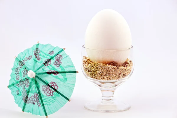 Ägg och paraply Stockfoto