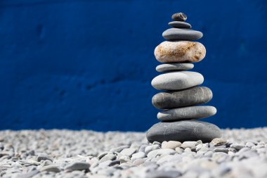 A pile of rocks stacked on the beach clipart