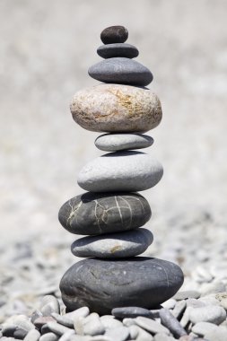 Rocks stacked on the beach clipart