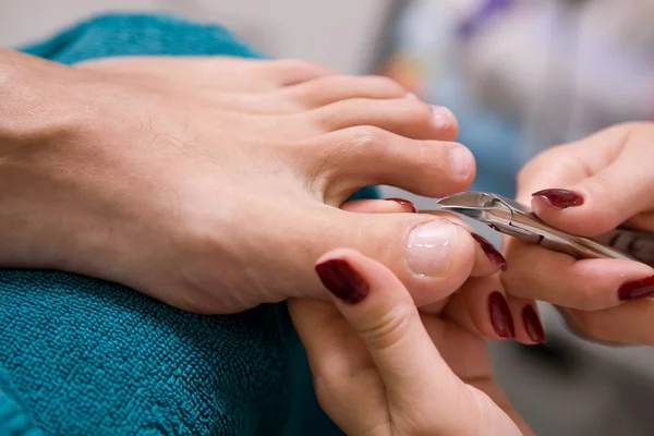 Man and the procedure of pedicure — Stock Photo, Image