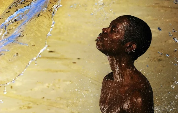 African boy and water — Stock Photo, Image