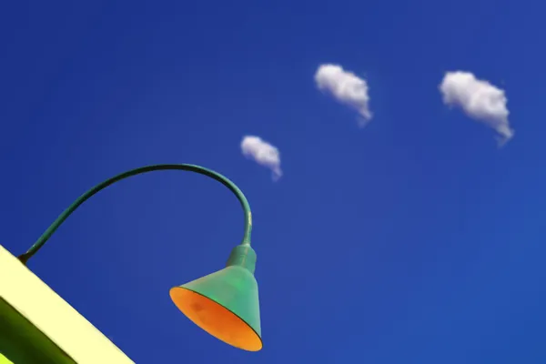 Lamp and clouds — Stock Photo, Image