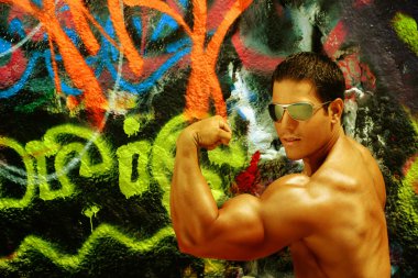 Body Builder against graffiti clipart